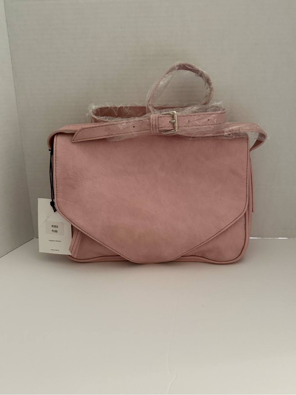 CO-LAB Pink Foldover Crossbody Bag featuring multiple front zipper compartments